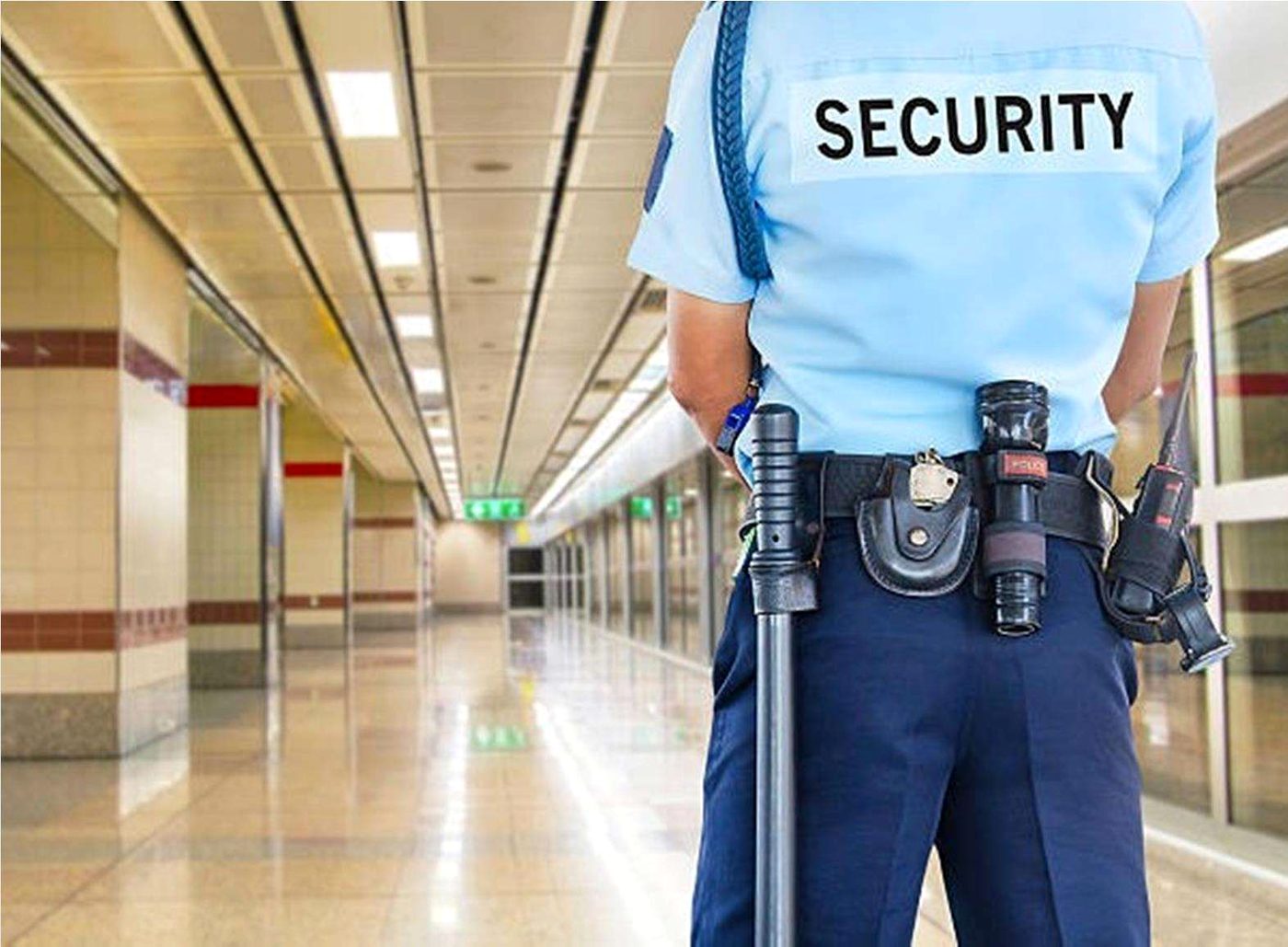 Uniformed TMS security guard on duty inside a commercial building